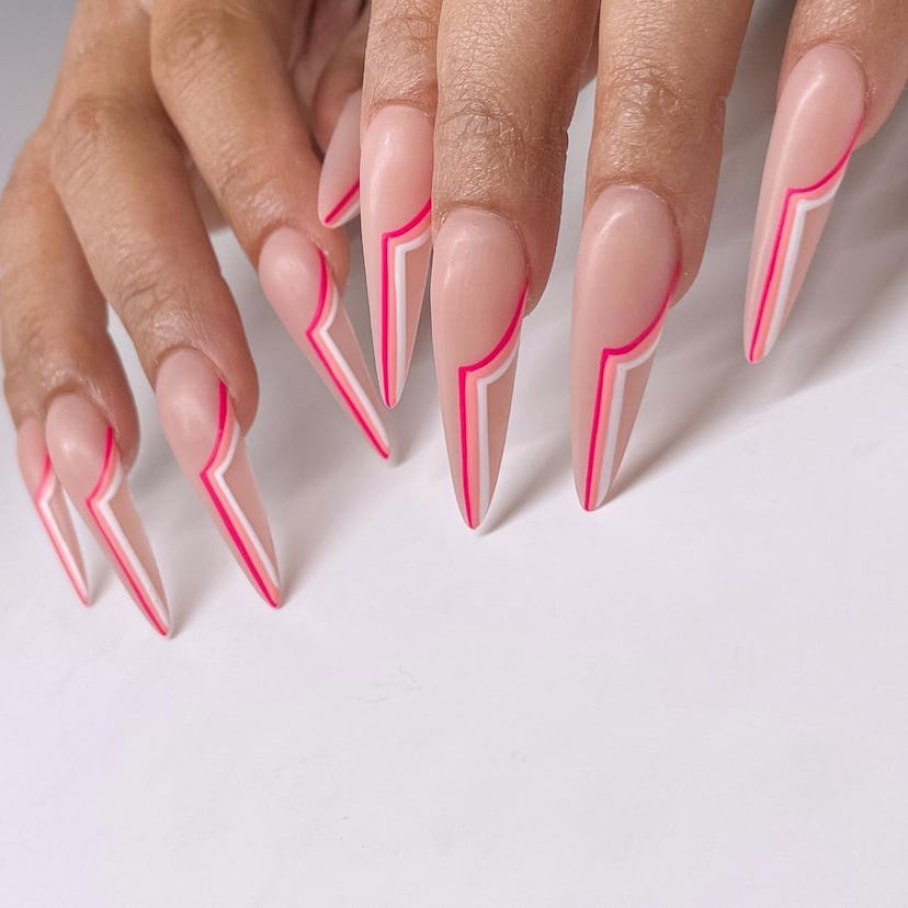 Retro pink line art on stiletto-shaped nails are on-trend for 2024.