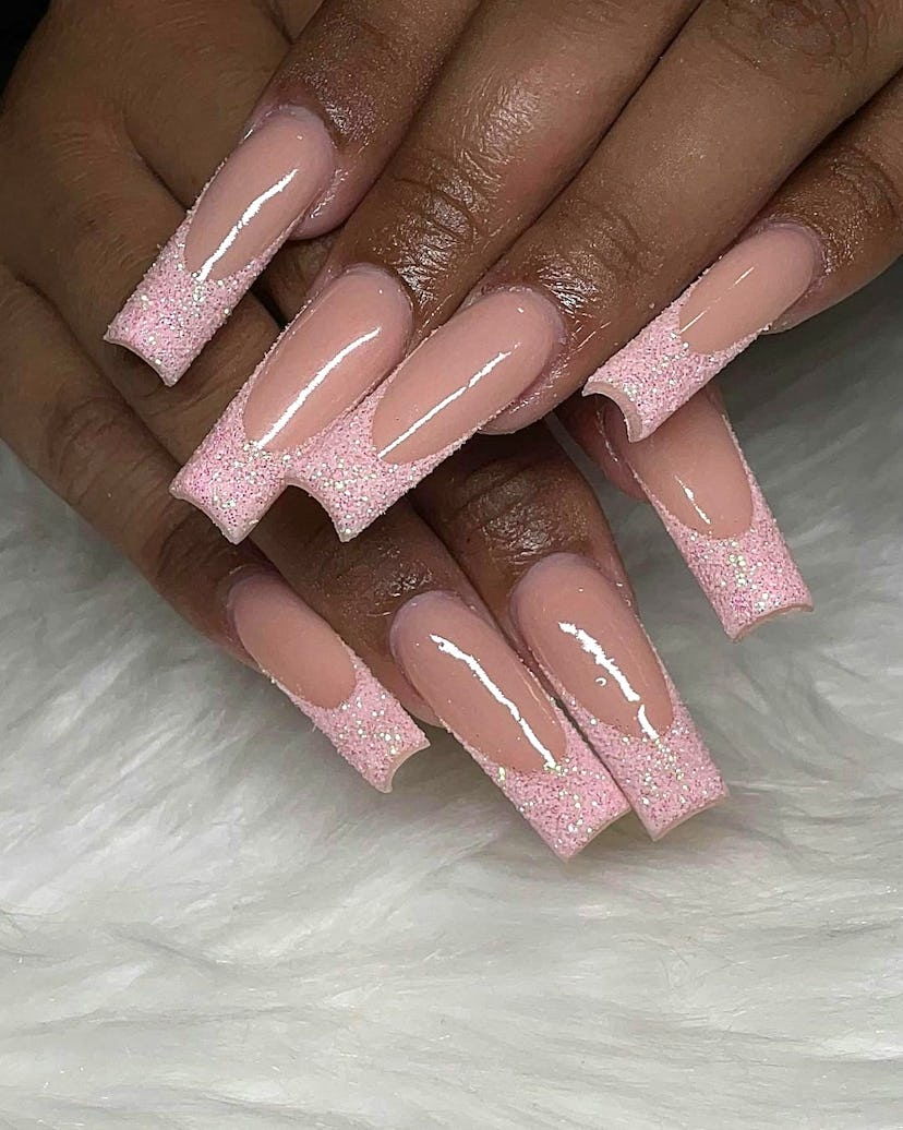 Glittering baby pink French tip nails are on-trend for 2024.