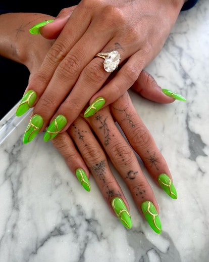 In April 2023, Hailey Bieber wore neon green glow in the dark nails.