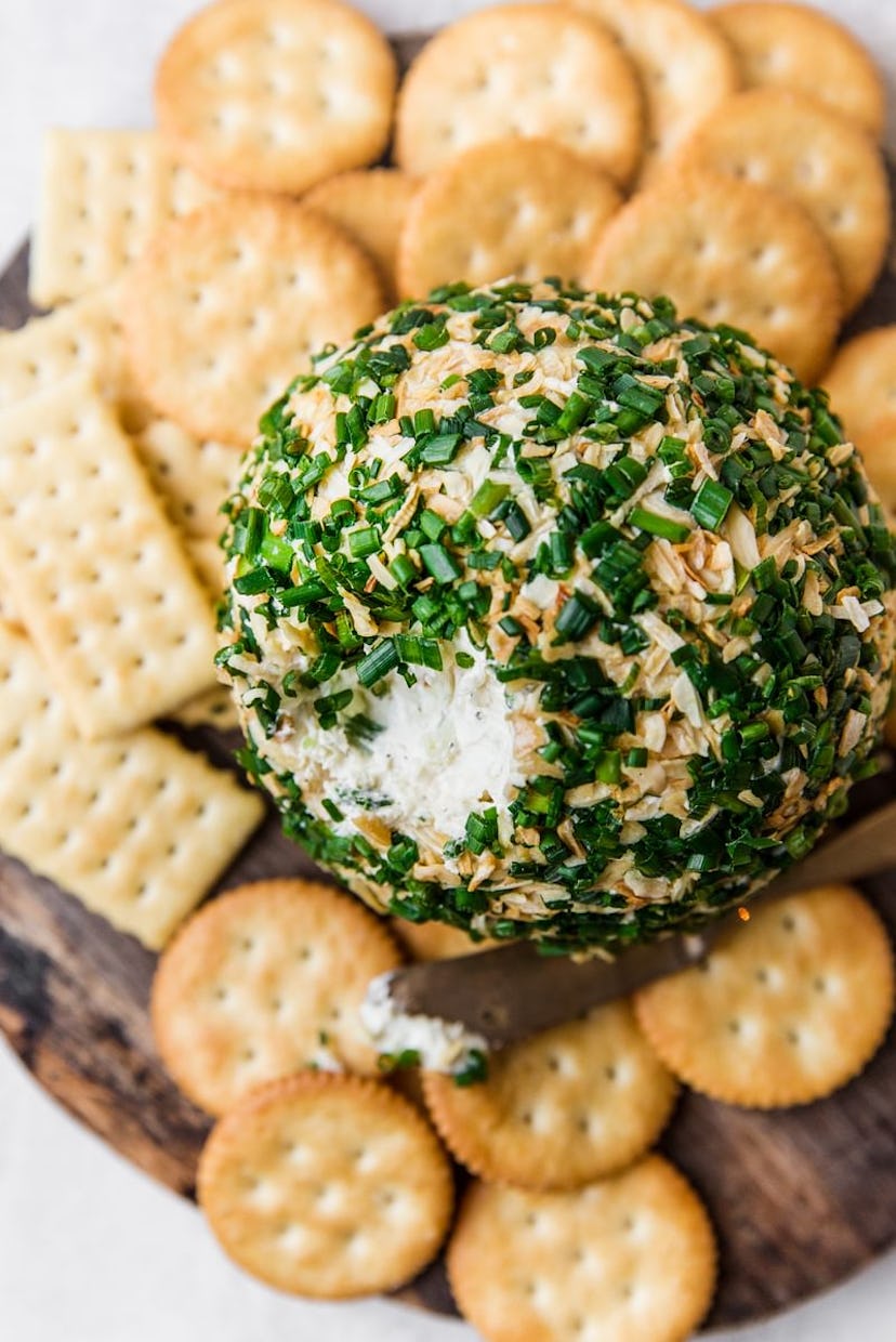Cheddar cheese ball with crackers in a list of Taylor Swift party food ideas