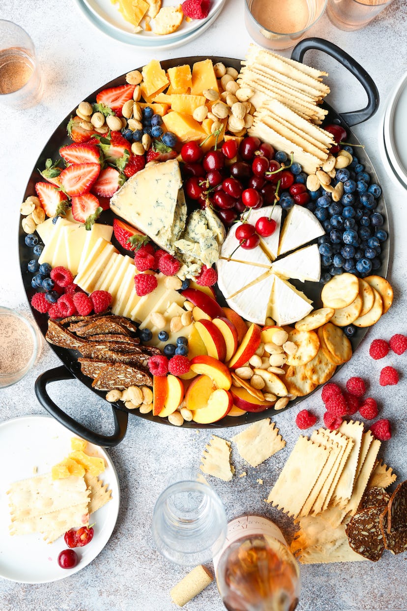Cheese and fruit board in a list of Taylor Swift party food ideas