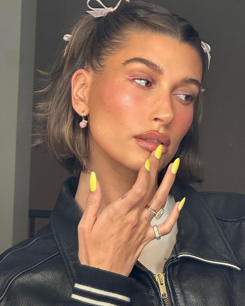 In March 2023, Hailey Bieber wore neon yellow nail polish.