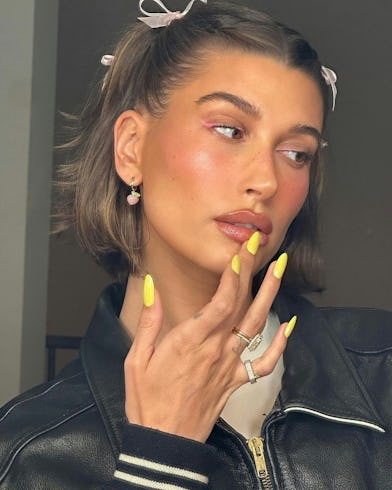 hailey bieber neon yellow nails