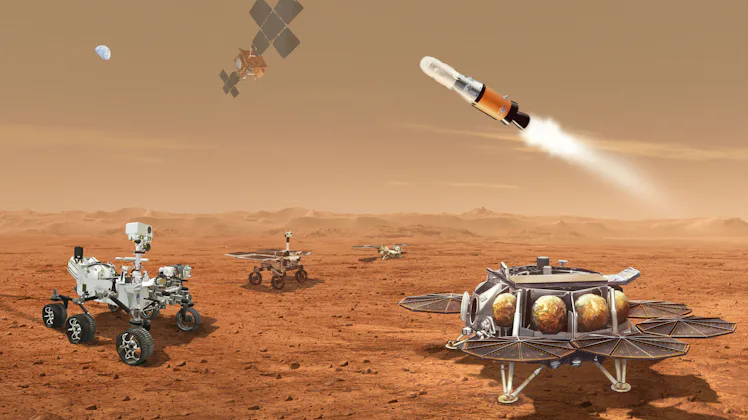 Four robots sit on Mars's surface, while two sail in the sky. In the distance, a blue Earth can be s...