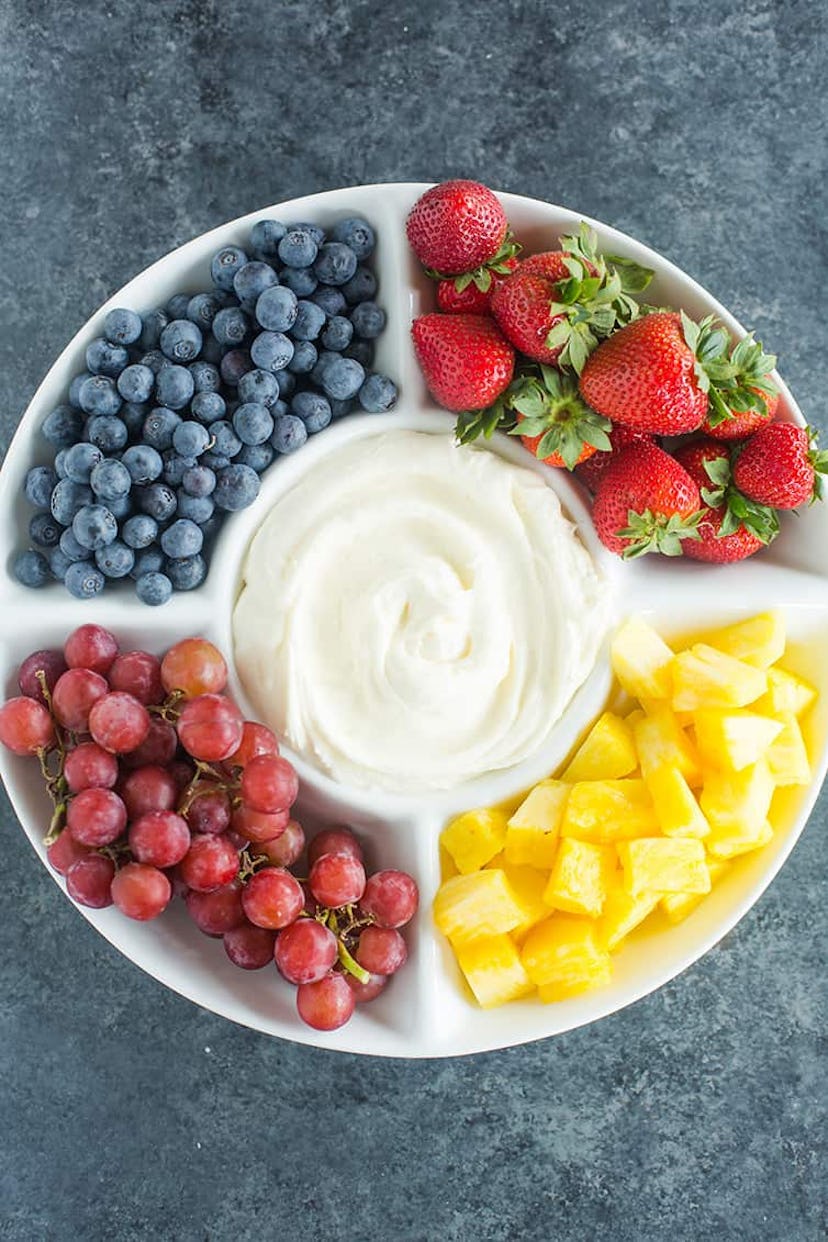 Fruit tray with fruit dip, in a list of Earth Day snacks and snack ideas.