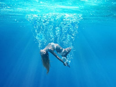 A girl sinks underwater on the poster for 'Under the Silver Lake'