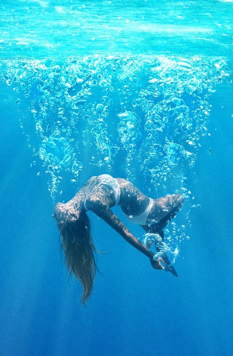 A girl sinks underwater on the poster for 'Under the Silver Lake'