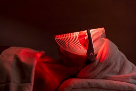 A woman used a red light therapy mask.