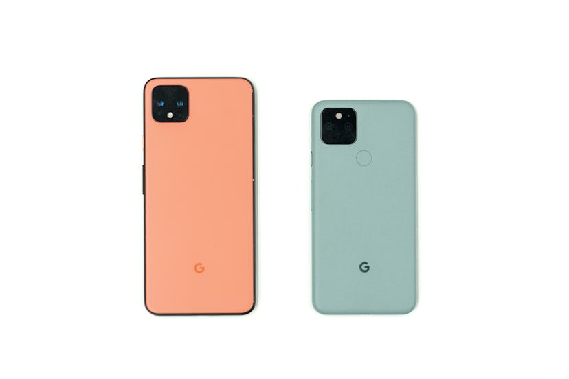 A photo of the Google Pixel 4 XL in orange and the Google Pixel 5 in sage green.
