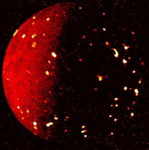 An abstract image of a bright red sphere with glowing particles scattered around it against a black ...