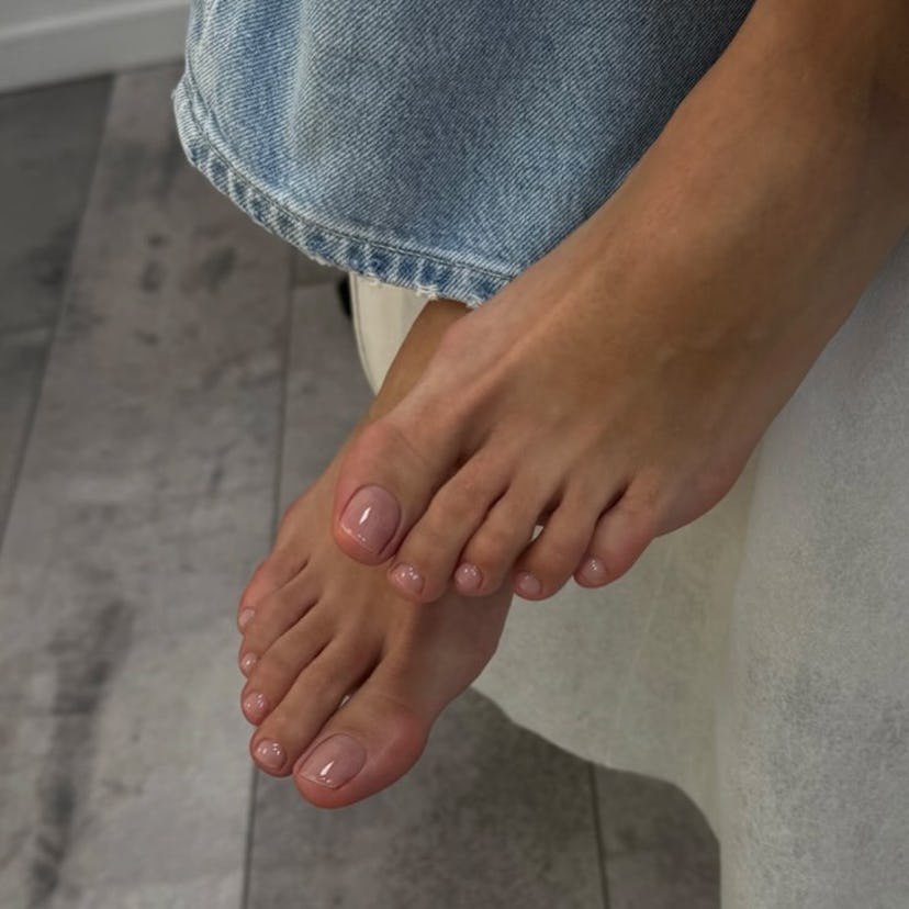 Sheer ballet pink pedicures are on-trend for summer 2024.