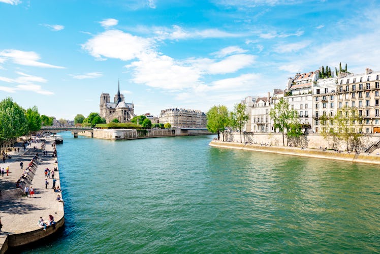 Walking along the Seine River toward Notre Dame.