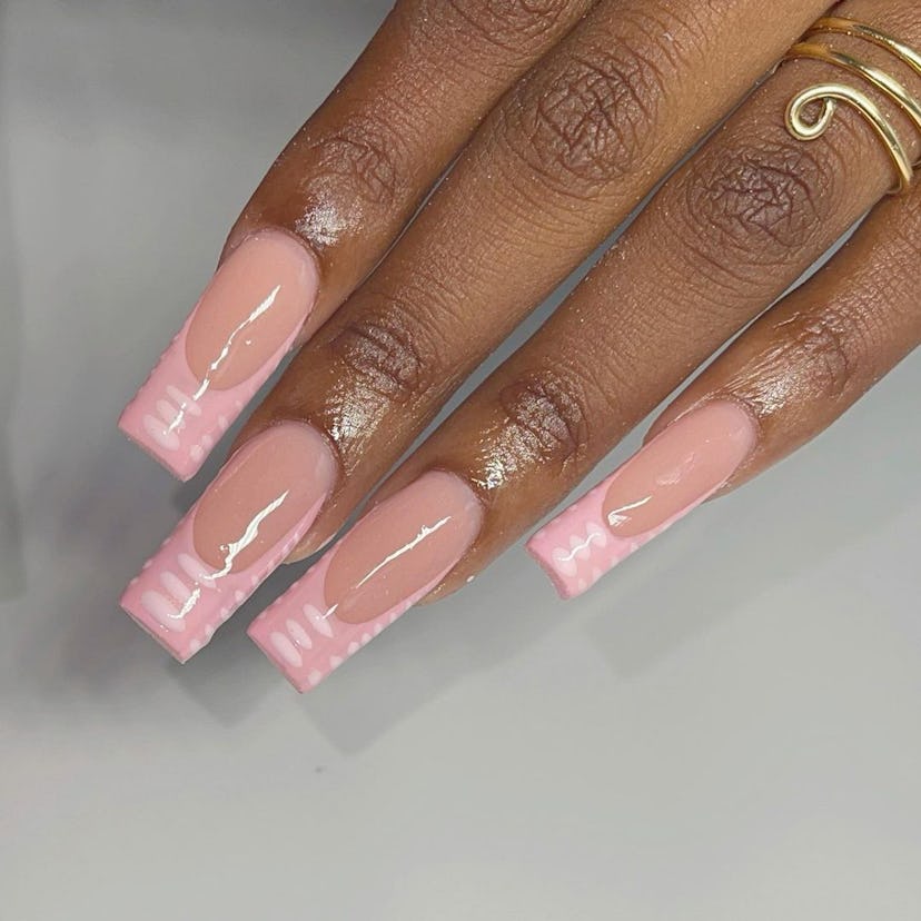 Try pale pink crocodile print French tip nails for Taurus season 2024.