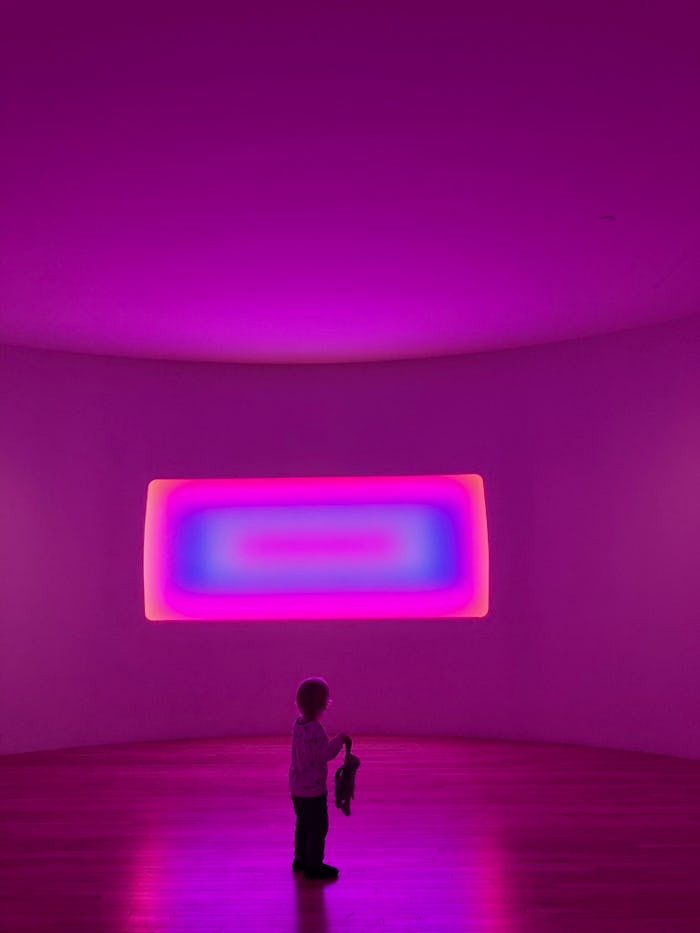 a young girl standing in front of James Turrell at MassMOCA