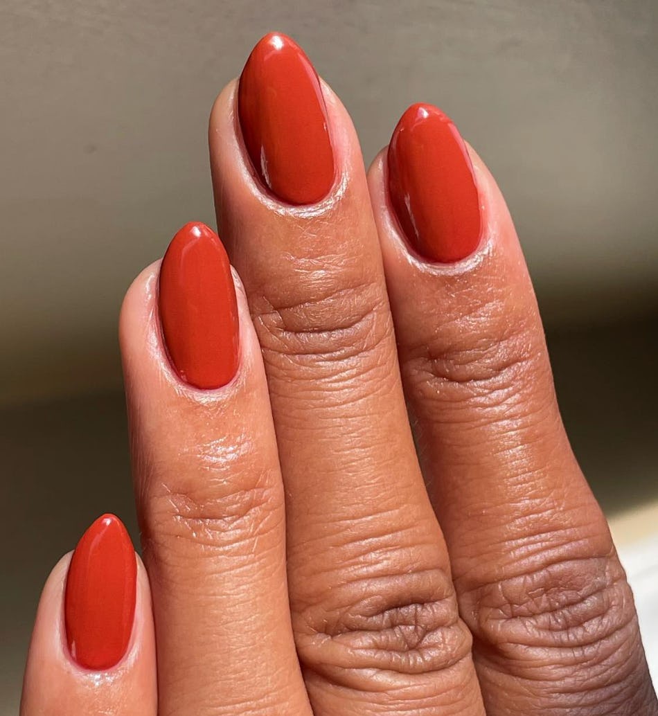Burnt orange nail polish is on-trend for summer 2024.