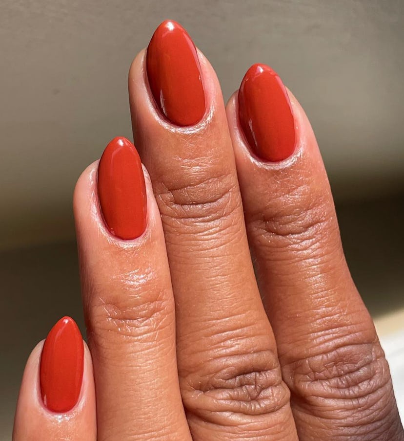 Burnt orange nail polish is on-trend for summer 2024.