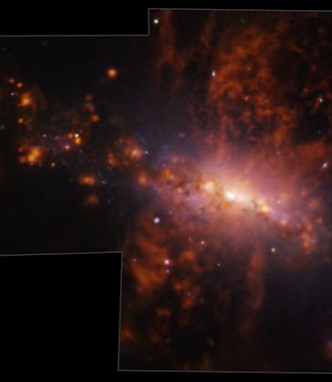 Bright spots, of different sizes, pepper the right side of a galaxy where a bright disk shines at it...