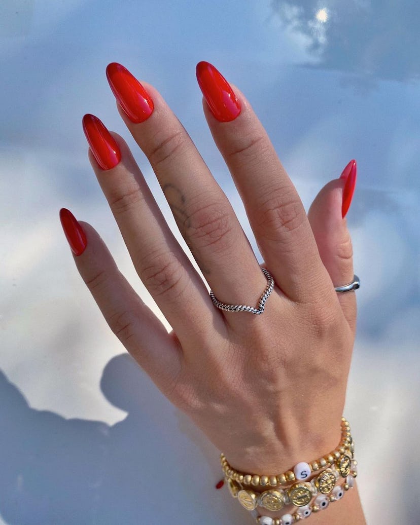 Monochromatic red French tip nails are on-trend.
