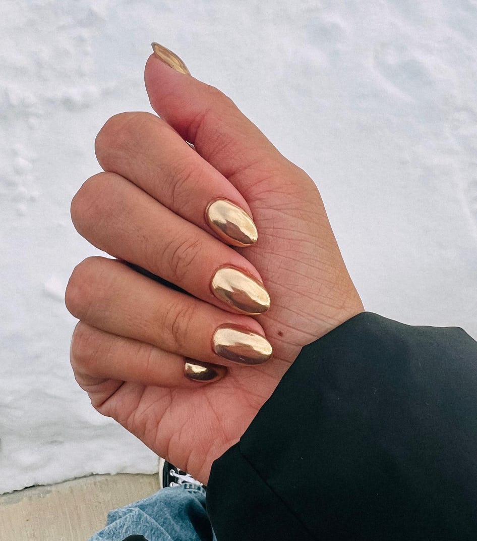 Chrome nail polish is on-trend for summer 2024.