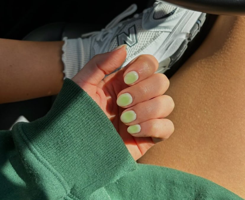 Seafoam green nail polish is on-trend for summer 2024.