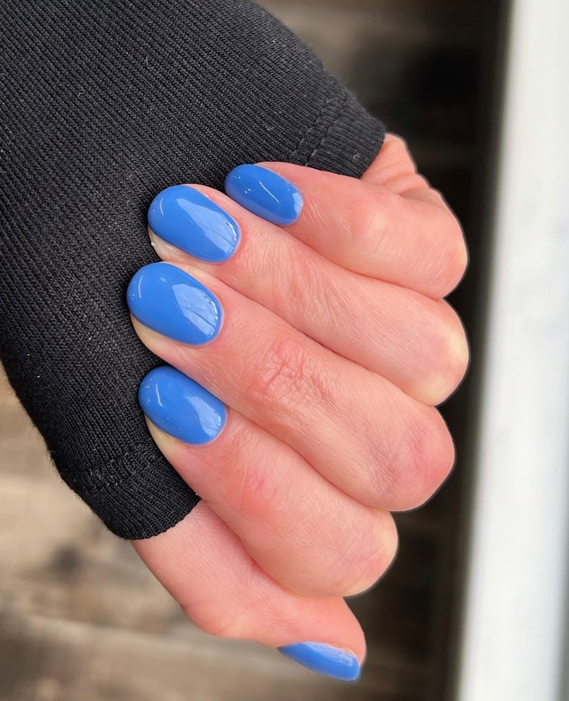 Blue nail polish is on-trend for summer 2024.