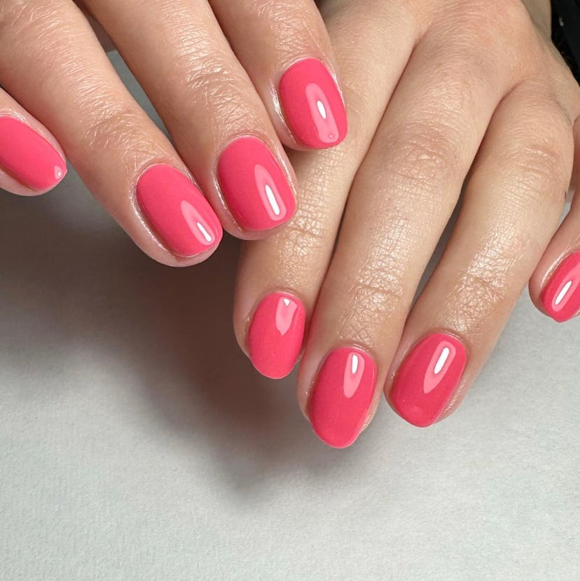 Pink coral nail polish is on-trend for summer 2024.