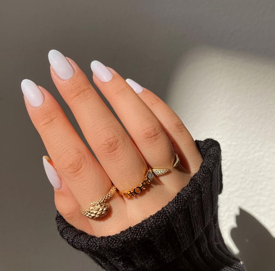 Milky nail polish is on-trend for summer 2024.