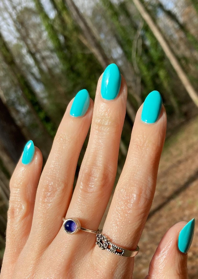 Aqua blue nail polish is on-trend for summer 2024.