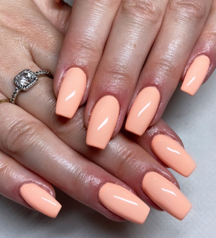 Peach nail polish is on-trend for summer 2024.
