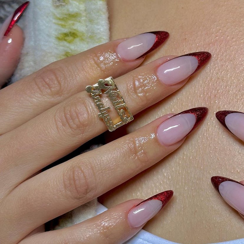 Red chrome French tip nails are on-trend.