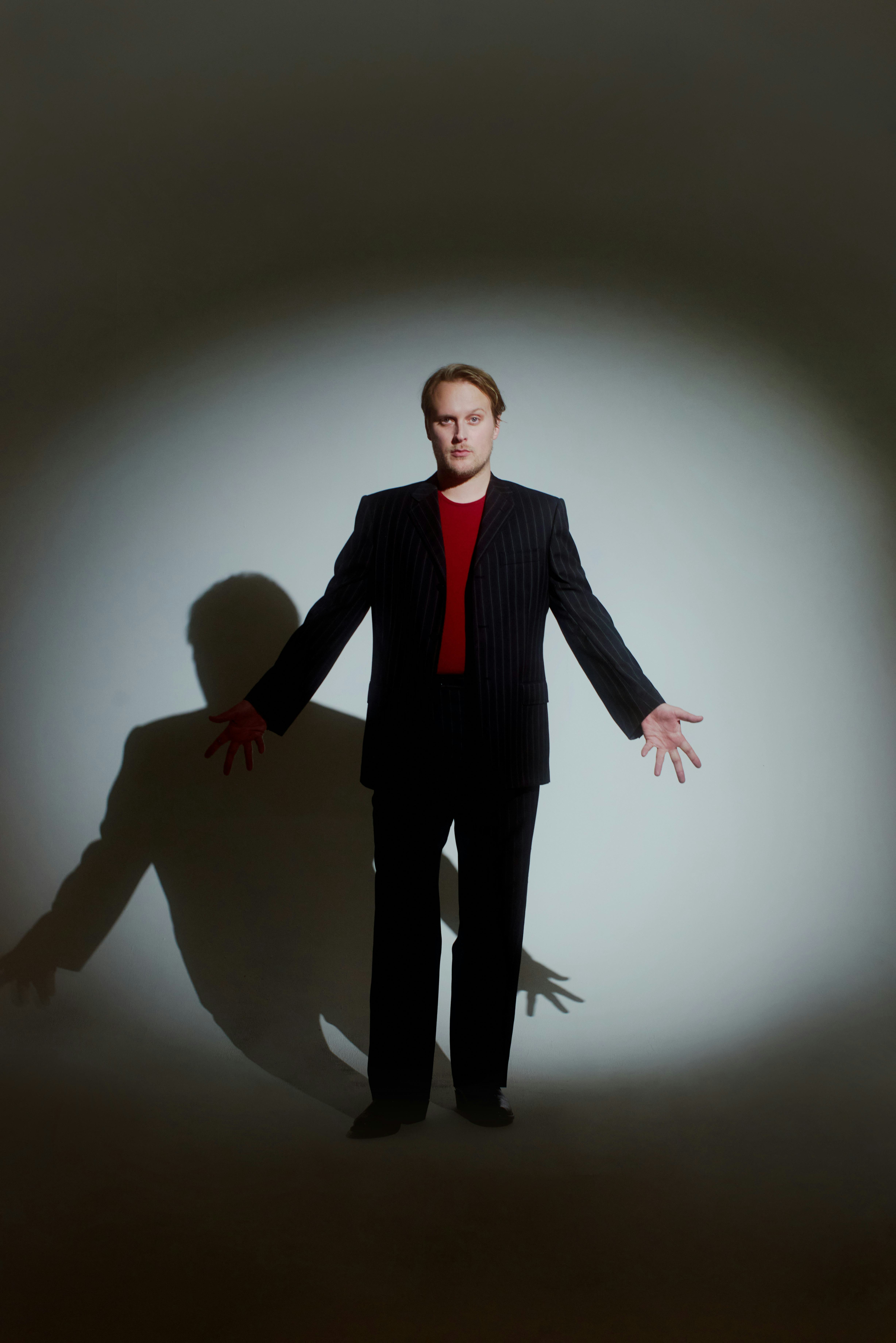 Early wears a Dolce & Gabbana suit; Sunspel vest; his own boots.