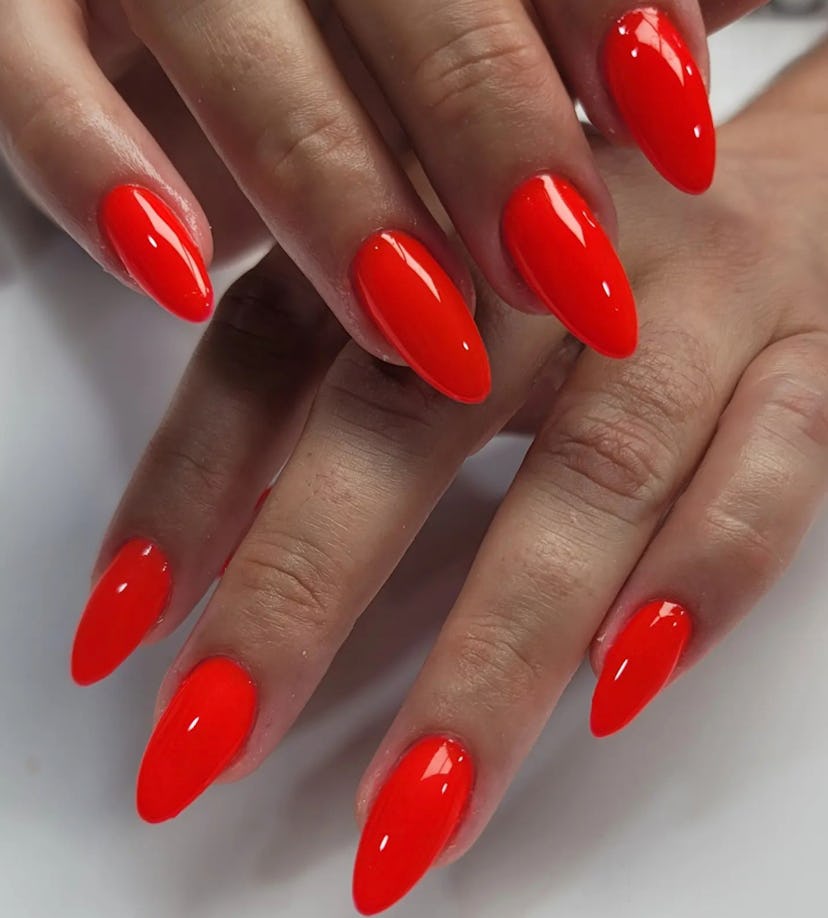 Red-orange nail polish is on-trend for summer 2024.