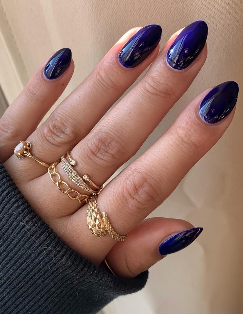 Navy nail polish is on-trend for summer 2024.