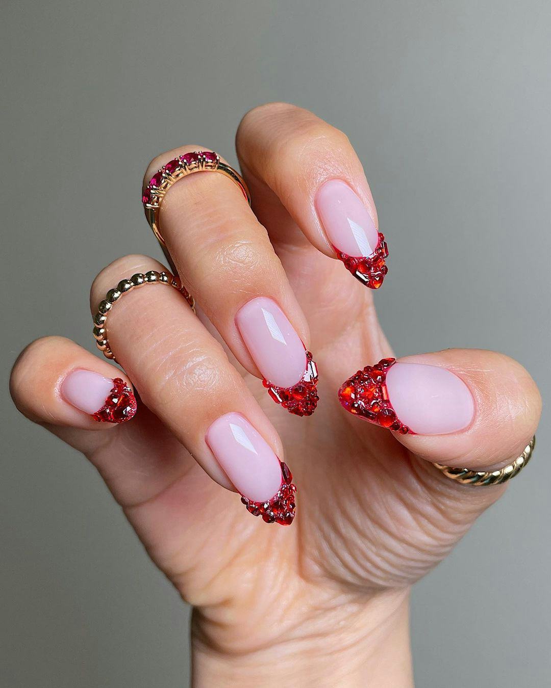 Bedazzled red French tip nails are on-trend.