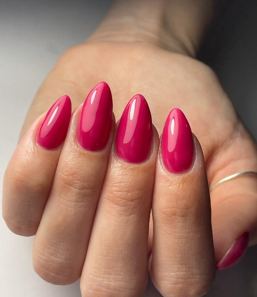 Raspberry nail polish is on-trend for summer 2024.