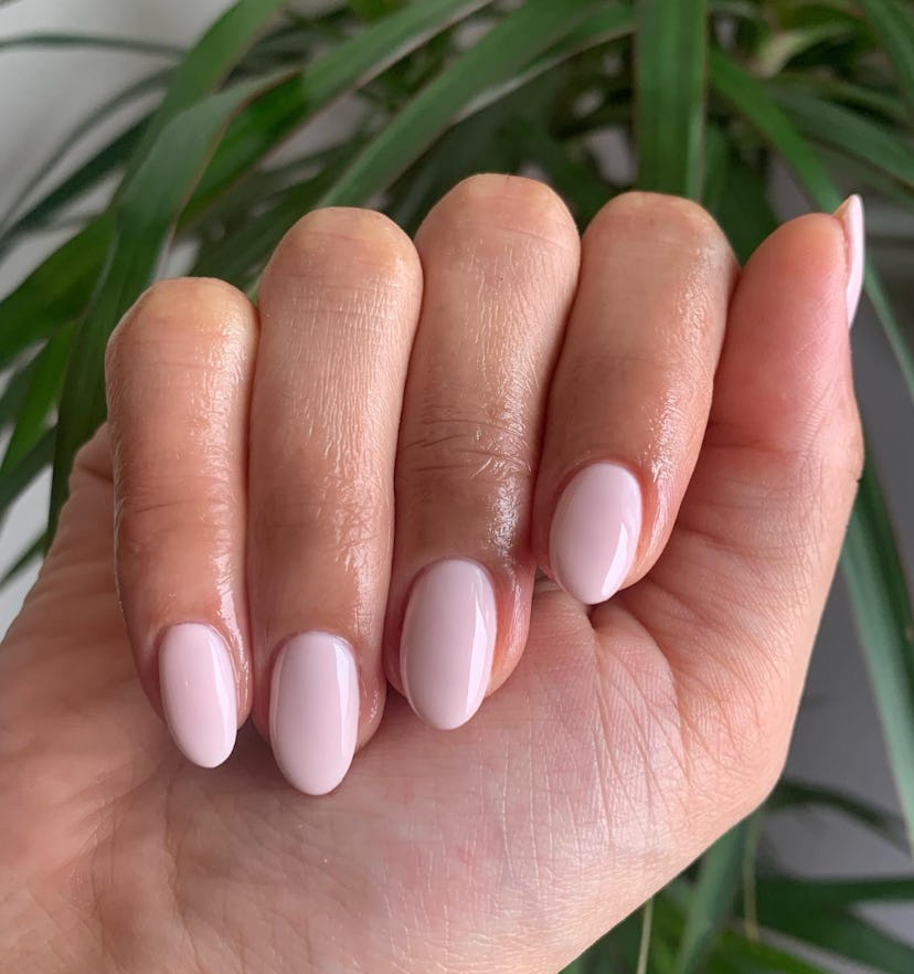 Soft baby pink nail polish is on-trend for summer 2024.