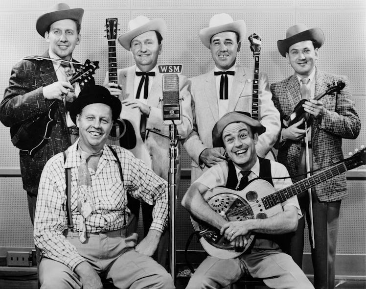 Lester Flatt (2nd from left) and Earl Scruggs (third from left) pose for a portrait with The Foggy M...