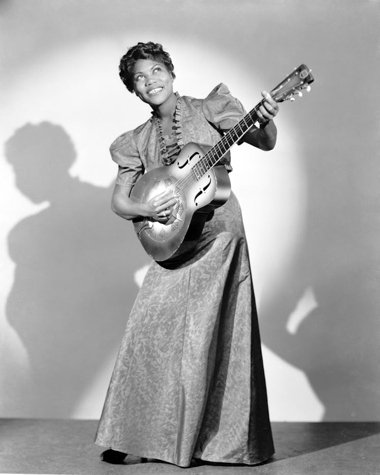 CIRCA 1940: Vocalist/guitarist Sister Rosetta Tharpe poses for a portrait holding a guitar in circa ...