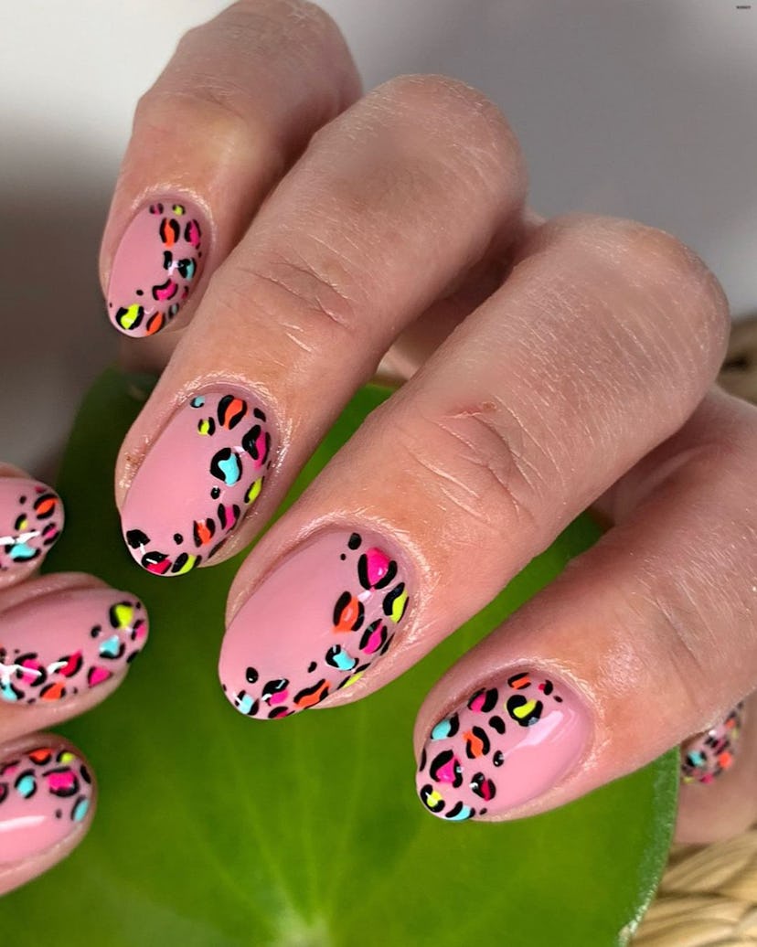 Lisa Frank-inspired rainbow leopard nail designs are on-trend.