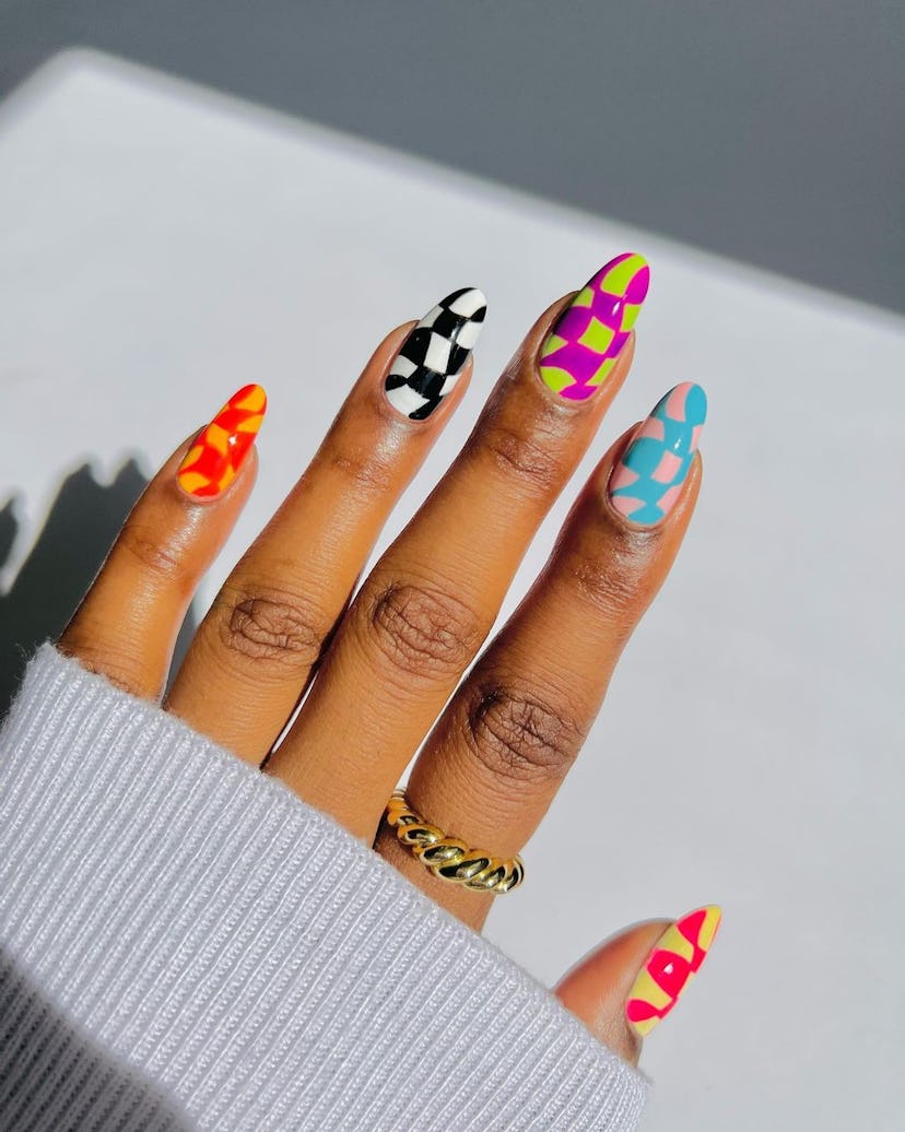 Distorted checkered nails are on-trend.