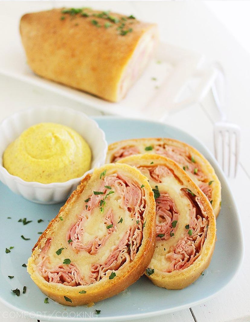One of the top cheesy dinner recipes to make is baked ham and cheese rollups.