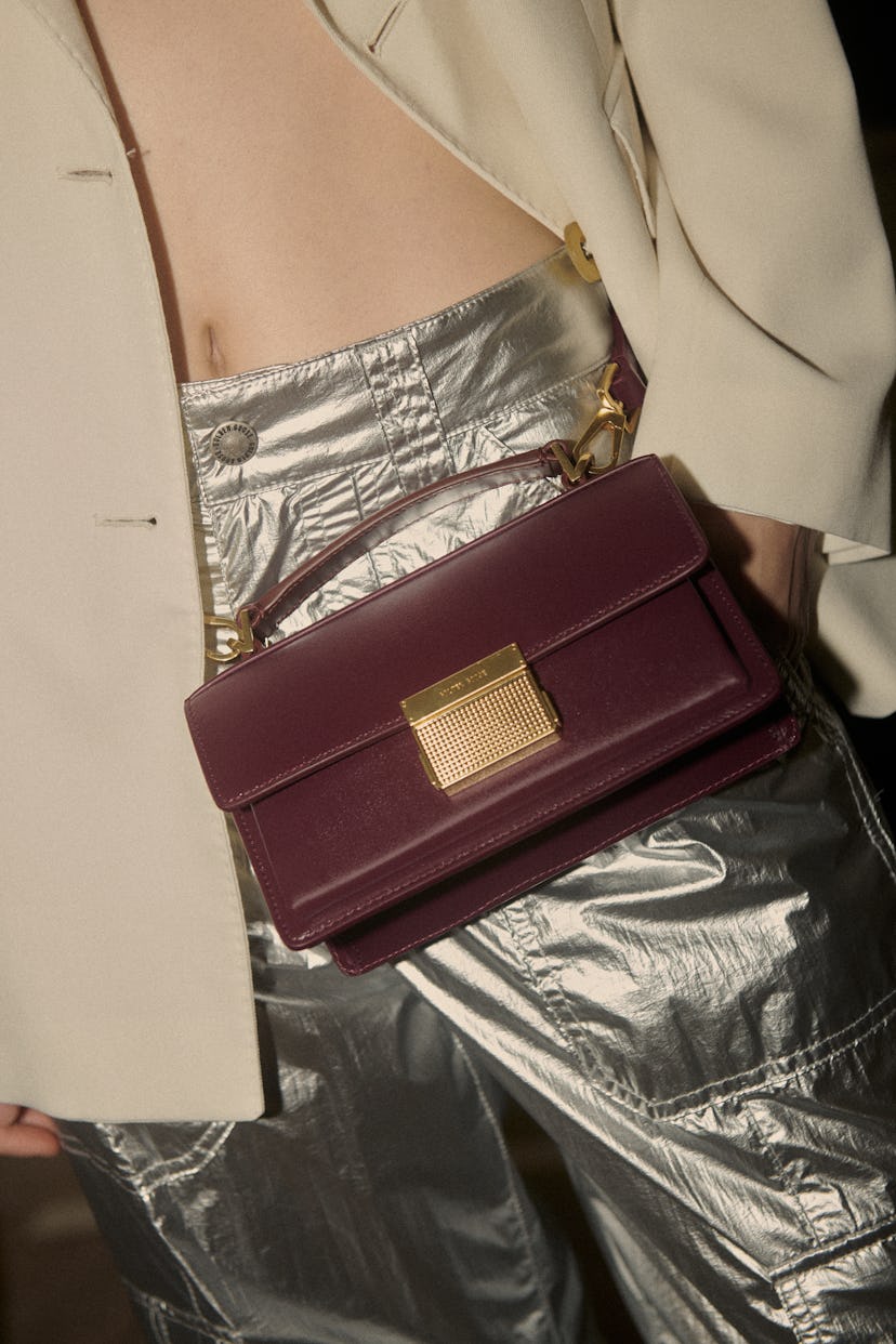 a model wearing a bag slung around her waist