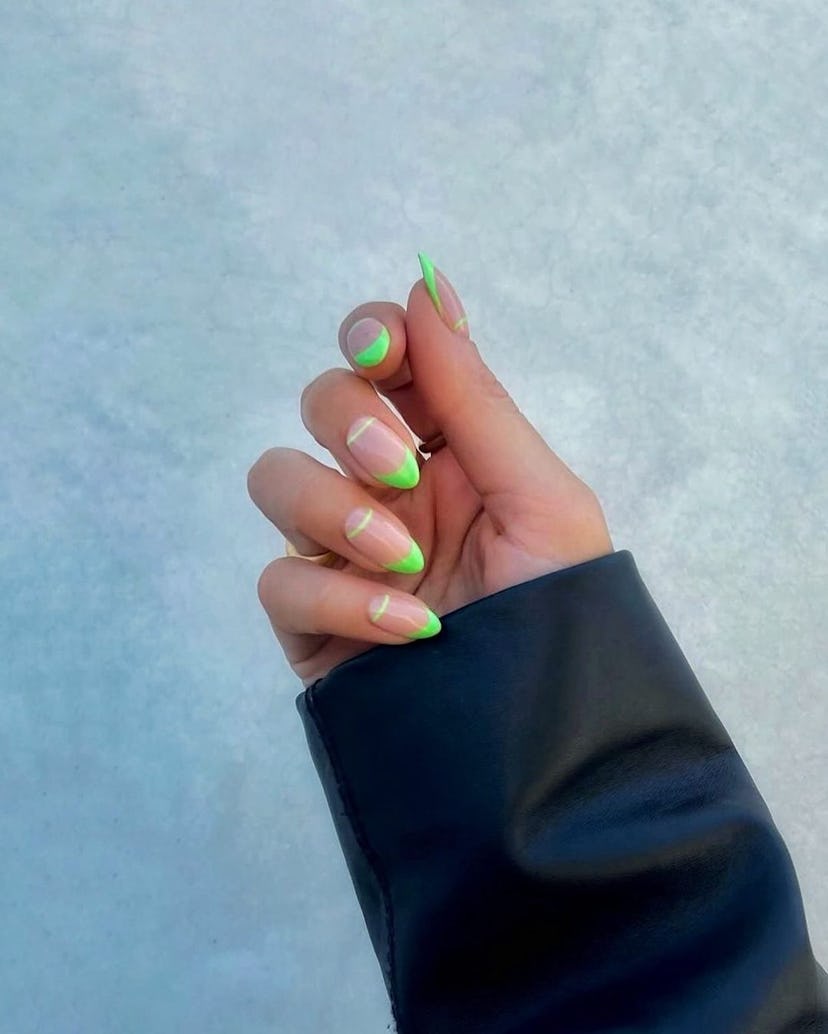 Lime green French tip nails are on-trend.