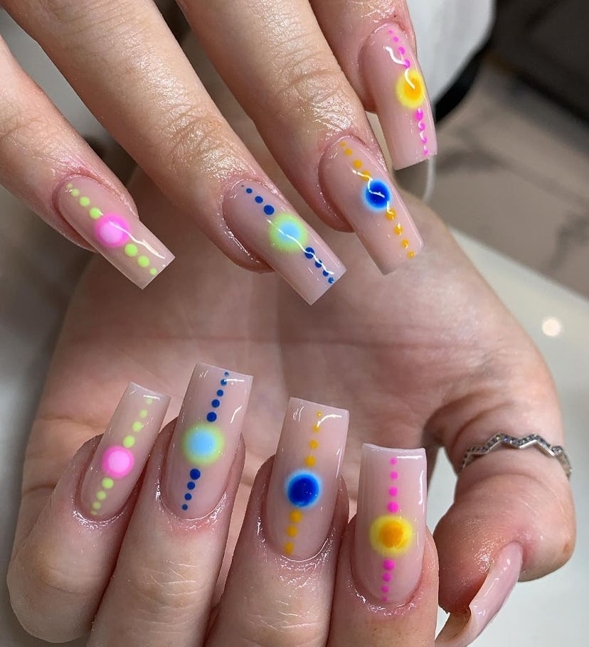 Dotted aura nails are on-trend.
