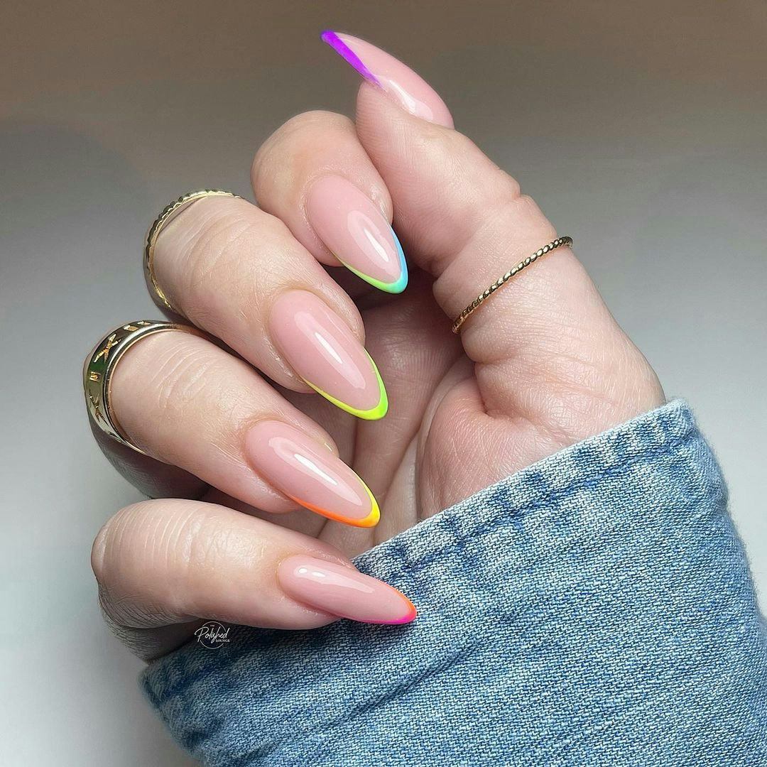 Rainbow micro French tip nails are on-trend.