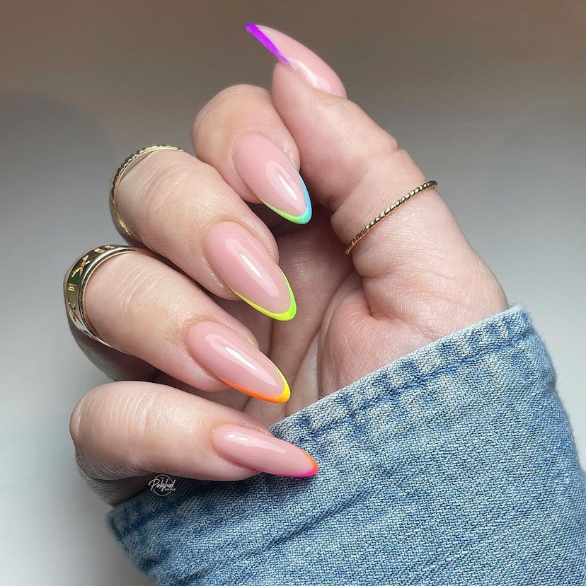 Rainbow micro French tip nails are on-trend.