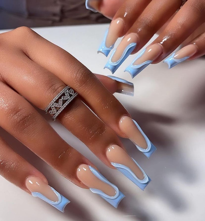 Abstract 3D sky blue French tip nails are on-trend.