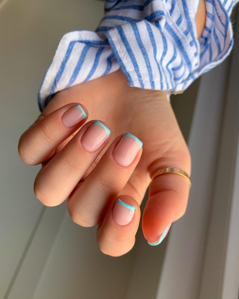 Tiffany blue French tip nails are on-trend.