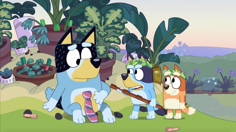 Bluey "threatens" Bandit with a stick while Bingo looks on in "Rug Island."