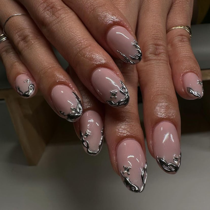 Try abstract silver chrome French tip nails.